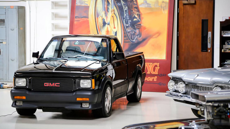 Jay Leno's Black GMC Syclone parked in his shop
