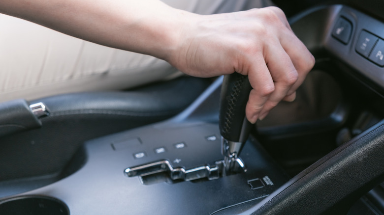 Hand on a zig-zag automatic shifter