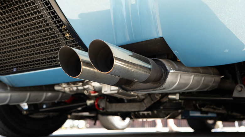 Close-up of a dual-exhaust pipe on a blue racing car