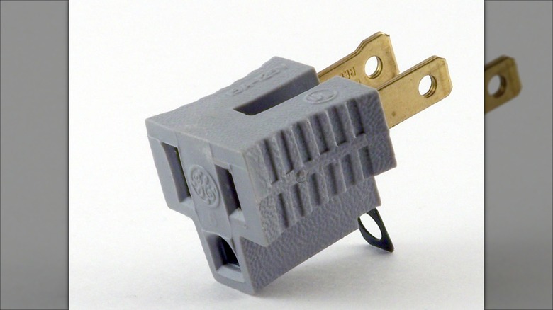 Cheater plug with tab