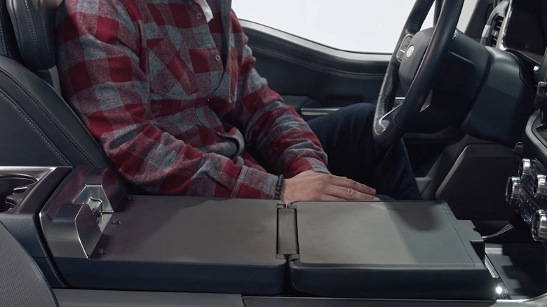 Close-up of the Interior Work Surface unfolded in a Ford F-150's center console