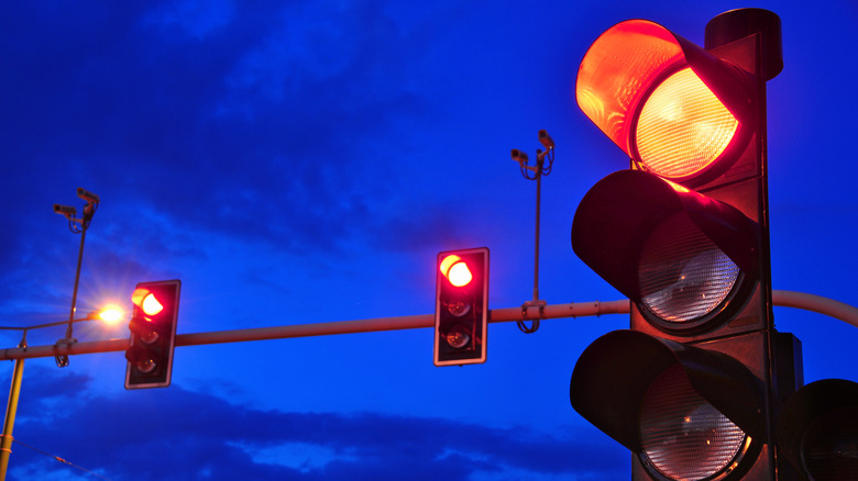 Traffic lights over sky after sunset