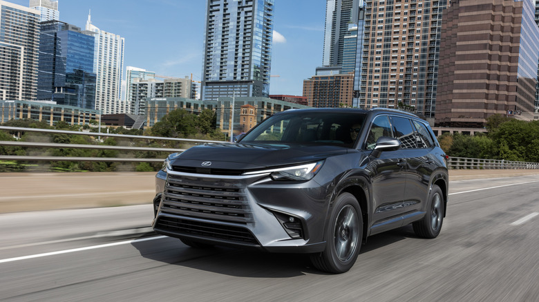 2024 Lexus TX 350 in dark gray driving on city road