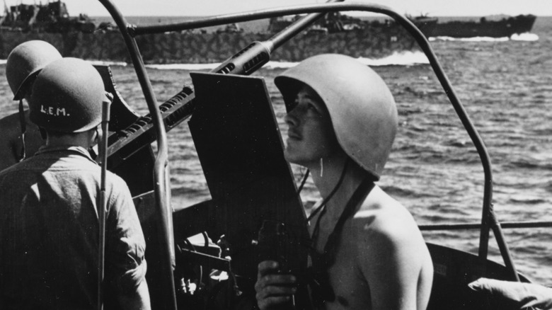 Navy officer wearing a talker helment.