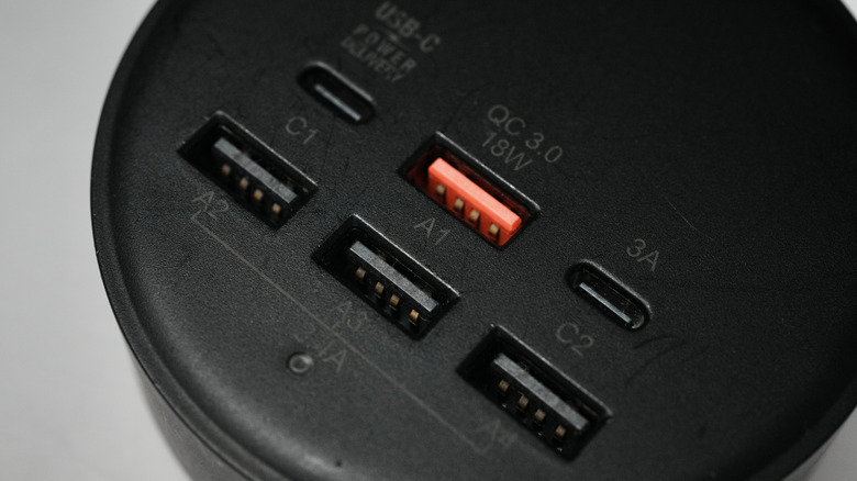 A close up image of a USB hub with a mix of USB-A and USB-C ports