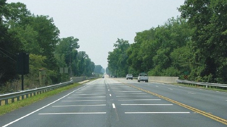 Speed reduction markings on the road while approaching a bridge