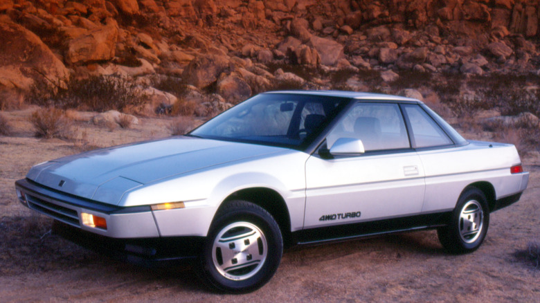 Subaru XT parked sand