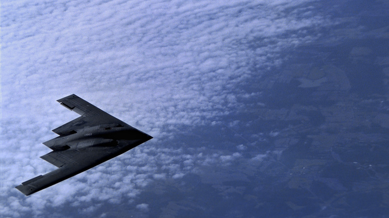 The Northrop B-2 Stealth Bomber approaches a A KC-10A Tanker from McGuire Air Force Base, New Jersey for mid-air refueling over the Midwestern U.S. on March 27, 2001.