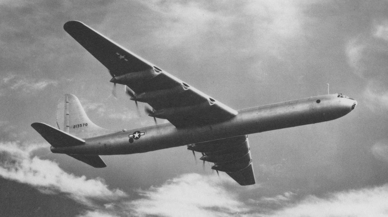 Black and white photo of underside of B-36 Peacemaker in flight