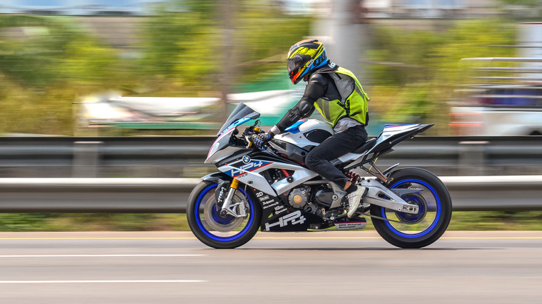 BMW HP4 Race, Motorbike driving with speed-effect with blur background on RamaII Road
