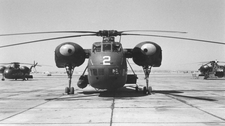 A black and white photo of three CH-37 Mojaves sitting on tarmac in 1963