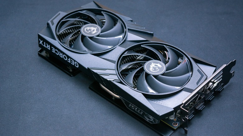 A dual-fan Nvidia graphics card on a grey background