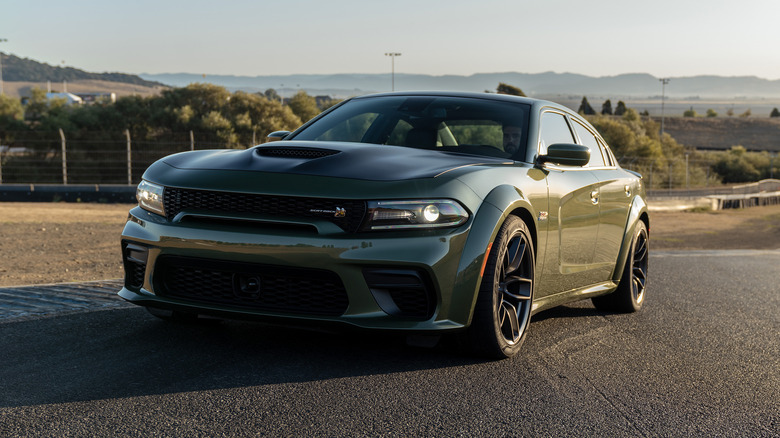 Green Dodge Charger Scat Pack on race track
