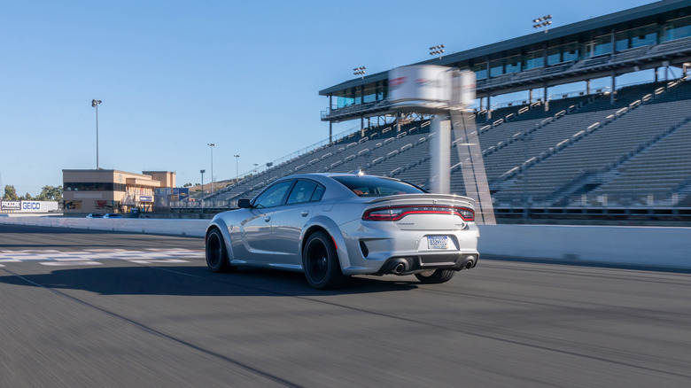 Dodge Charger crossing finish line on race track