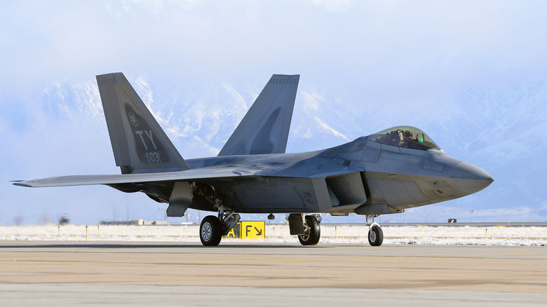 an f22 raptor gets ready to take off