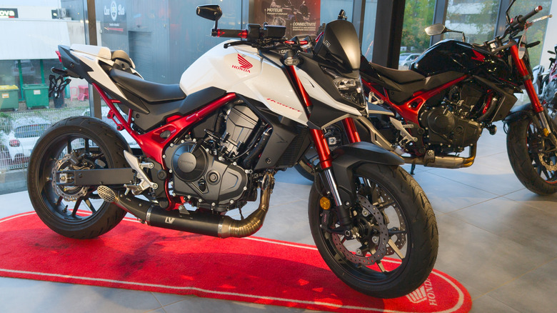 A red and white CB 750 Honda Hornet
