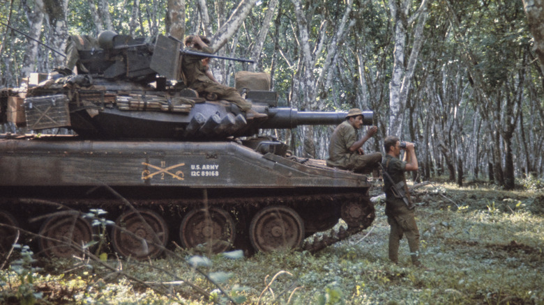 Three soldiers with M551 Sheridan tank