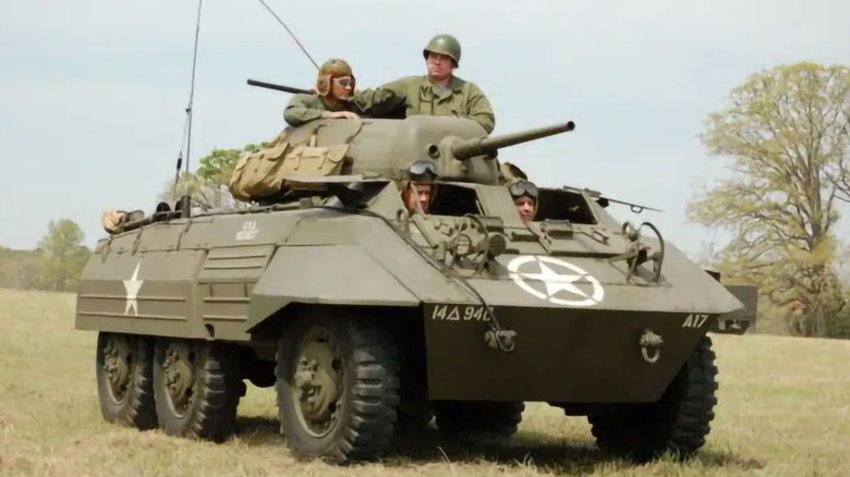 color photograph of soldiers in an M8 Greyhound light armored vehicle