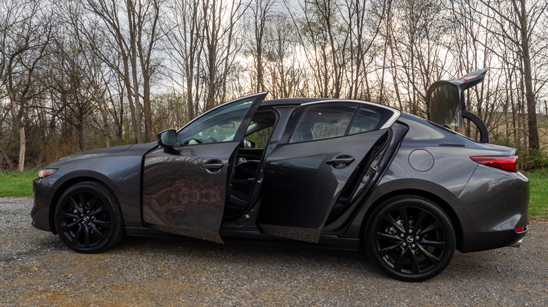 2026 Mazda Mazda3 2.5 Turbo Premium Plus driver's side profile with doors and trunk opened