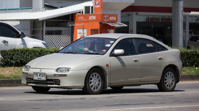 Mazda Lantis on city street