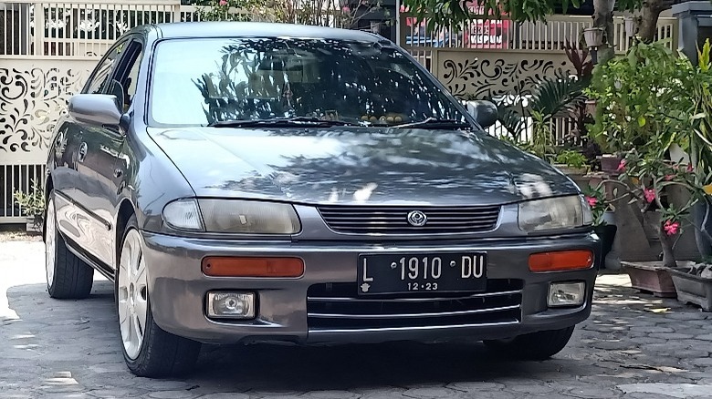 Mazda Lantis near plants