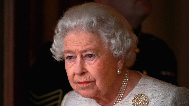 Queen Elizabeth II looking stoic