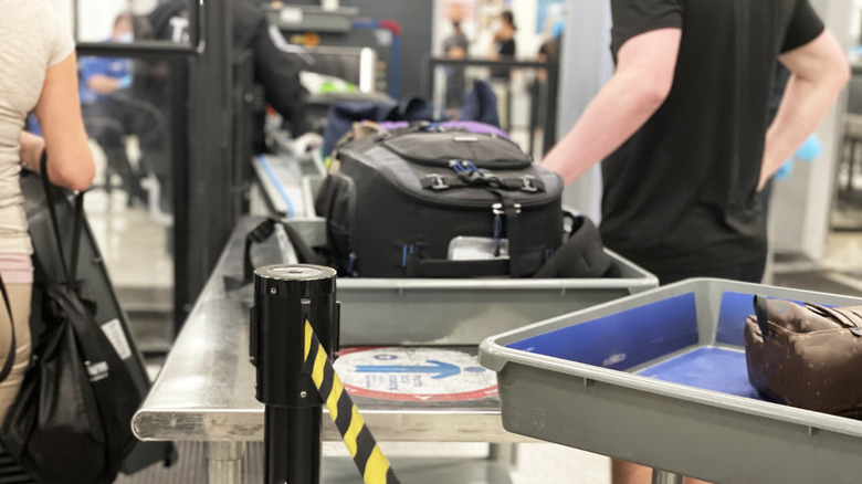 Check in luggages going through security line