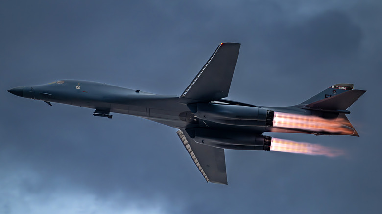 B1-B Lancer Bomber flying showing red flame exhaust