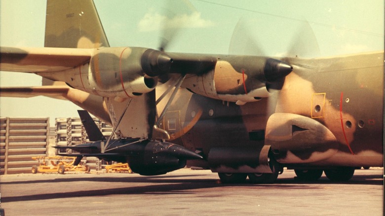 A Ryan Built drone underslung on a DC-130 launch aircraft, Bien Hoa Airbase.