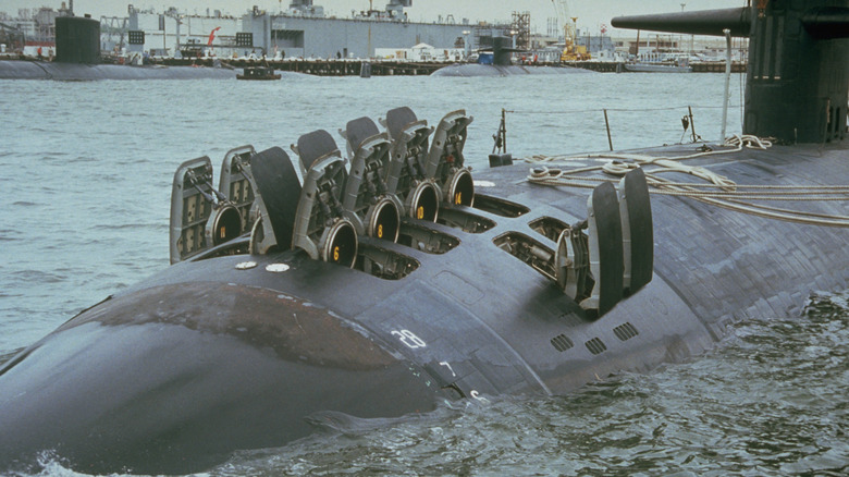 Missile tubes on a surfaced submarine open
