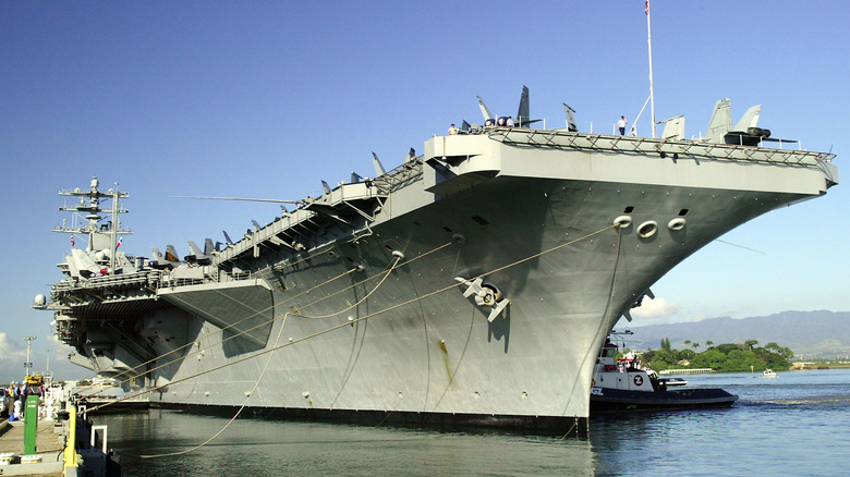Aircraft carrier moored shore side