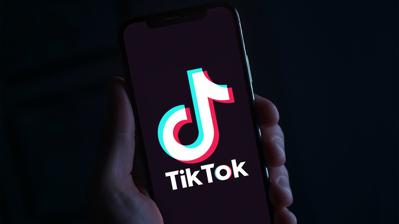 TikTok on phone in hand