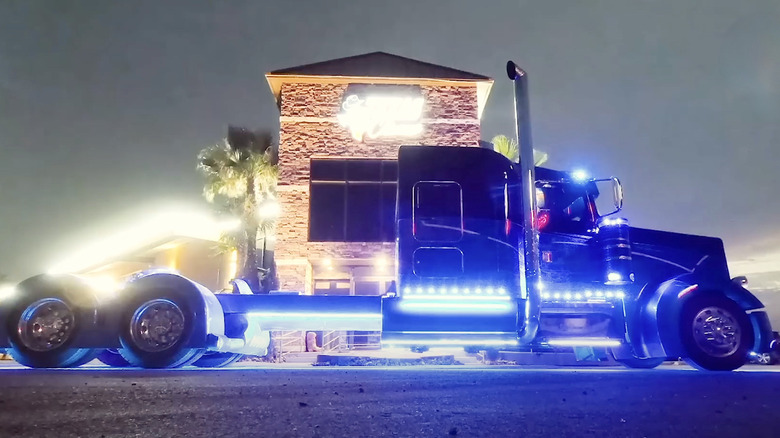 Kenworth semi truck pictured with custom lights turned on