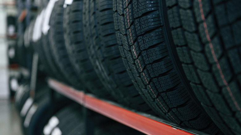 Close-up of new tires on rack