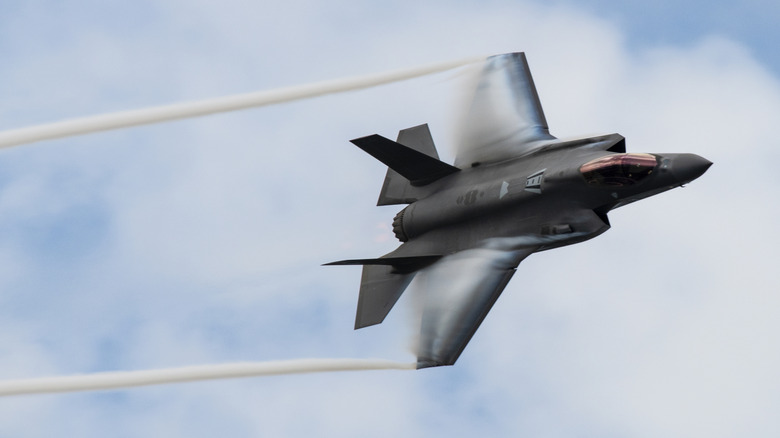 F-35 fighter jet soaring through air at show