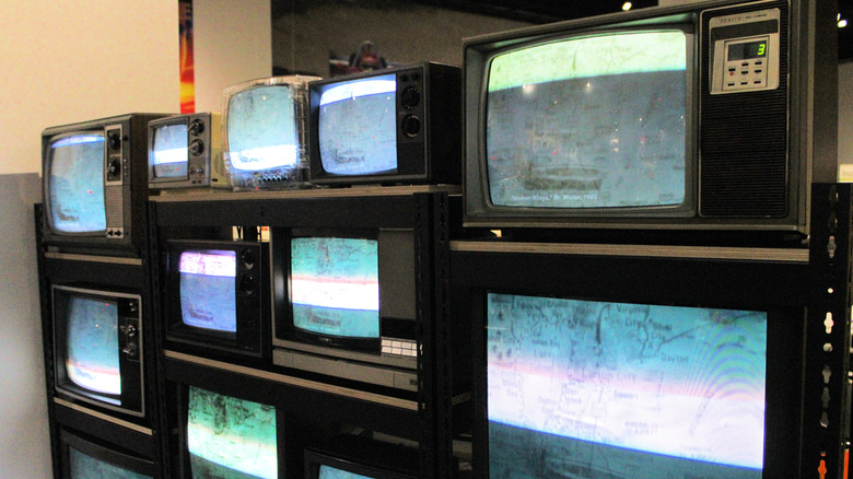 Display of vintage televisions from the early 80s at an exhibit in the Peterson Auto Museum in Los Angeles.