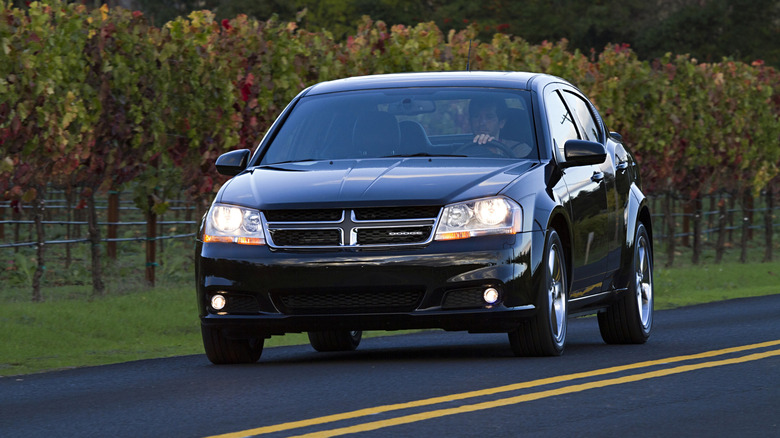 2012 Dodge Avenger on the road, black exterior