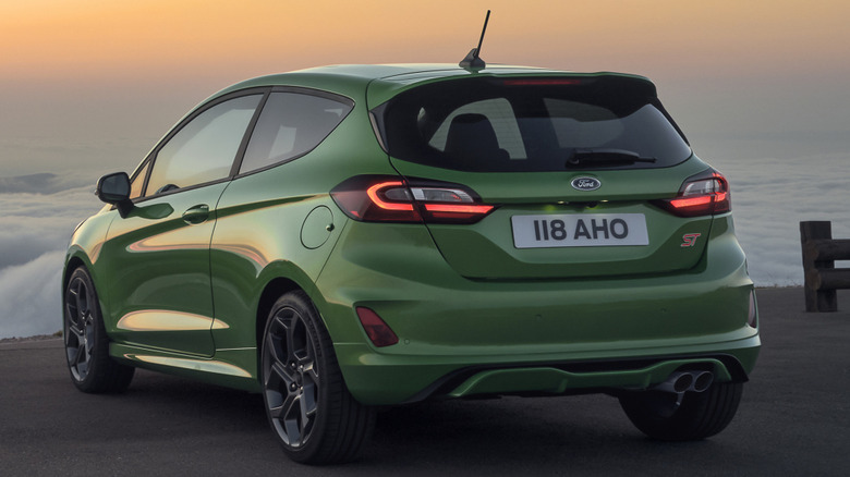 A Ford Fiesta ST parked at a scenic overlook at sunset