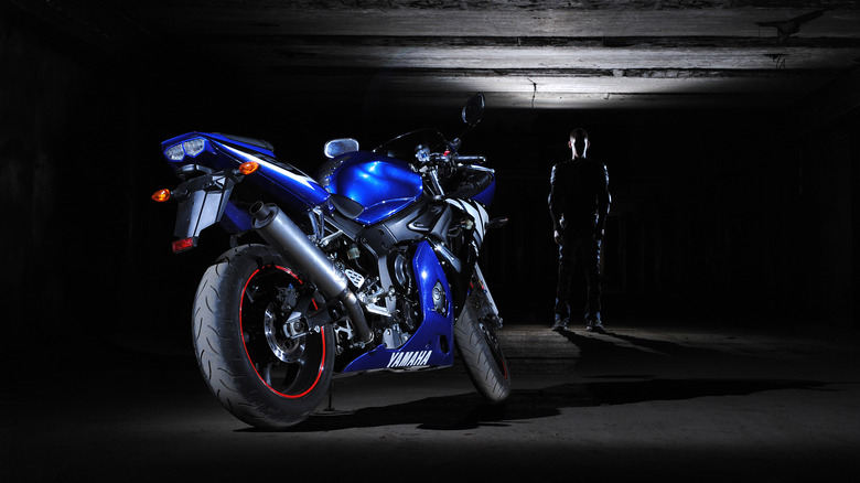 Yamaha R6 with racer in the background
