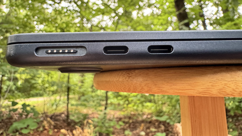 A close up of USB-C ports on a MacBook Air in an outside setting