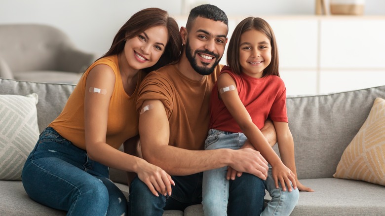 Happy vaccinated family