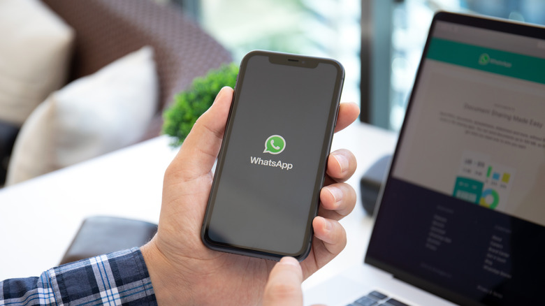 Person using WhatsApp on their phone.