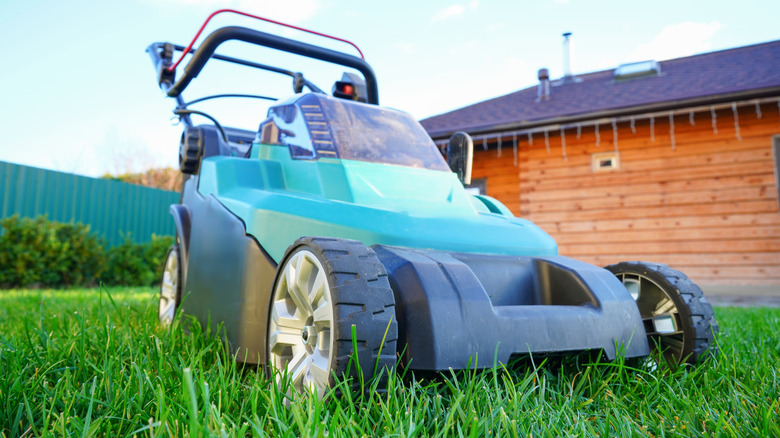 An electric mower with a plastic cutting deck