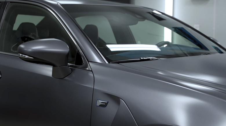 a lexus sedan with matte gray paint