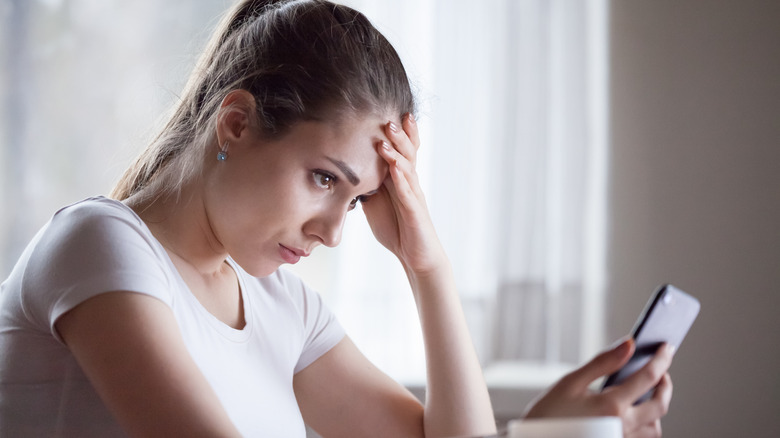 stressed woman with phone
