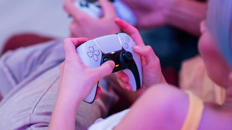 Person using PS5 controller