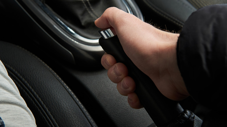 Driver engaging the emergency brake
