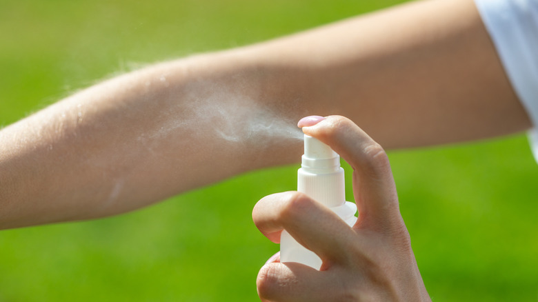 bug spray on arm