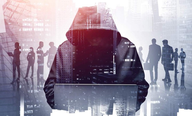 Hacker sitting in front of a computer 