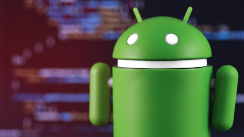 Android mascot with code in the background